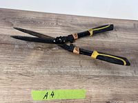 Full view of Fiskars hedge shears closed on tabletop
