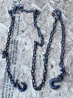 Full view of the entire tow chain laid out showing overall length and both hooks