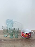 full lot: plastic cup, five glass tumblers, ceramic mug