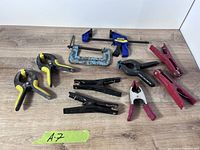 All twelve clamps laid out on table