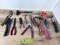 All twelve hand tools laid out on table