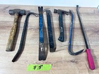 All seven tools laid out on wood surface