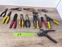 Group shot of all 13 tools laid on table