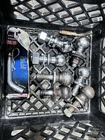 All items in crate: seven hitch balls, TowSmart hitch pin package