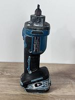 Front view of Makita DCO181 cut-out tool showing full body and battery base
