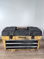 Closed toolbox front view showing brand and three drawers