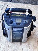 Front view showing label, cables, compressor unit