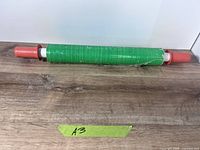 Entire green stretch wrap roll with handles