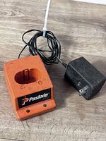 Front view of Paslode charger and power adapter