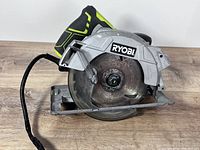 Left side view showing Ryobi branding, blade and cord