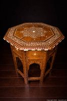 Full view of octagonal bone-inlay table top and legs