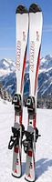 Front view of both Atomic skis standing upright on snow
