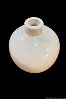 Top angled view showing flared neck and glossy opaline surface