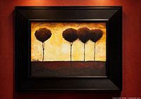 Framed painting on wall, full view showing artwork and frame