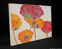 Front angled view of painting showing poppy design and canvas depth