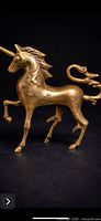 Full view of solid brass unicorn, rearing pose
