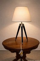 Full lamp on round table, shade illuminated