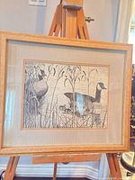 Front view of framed lithograph showing image, mat and frame