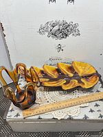 Overview of both pieces with ruler for scale