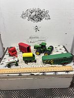 All six die-cast farm vehicles displayed together