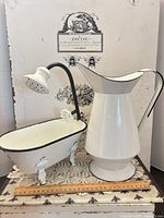 pitcher and mini clawfoot tub together on display