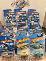 All nine carded Hot Wheels arranged on tabletop