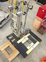 All four items grouped: both dollies, aluminum hand truck, steel hand truck