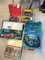 All items displayed on floor with open cases and accessory boxes