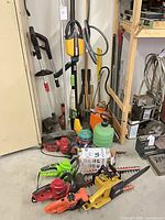 Overall view of multiple electric garden tools and pump sprayer