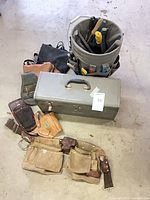 Group shot showing Craftsman toolbox, tool belt, bucket caddy with tools