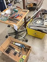 Hand tools on rolling tray and in wooden drawer