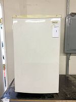 Front view of Magic Chef compact refrigerator, closed door