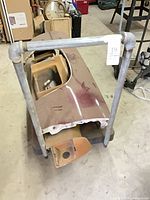 Top view of maroon Grand Prix rear quarter panel showing overall size and attached inner pieces