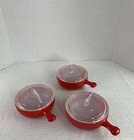 Three closed casseroles showing overall style and color