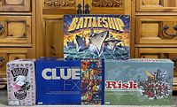 Group shot of all four board game boxes