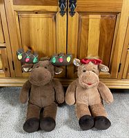 Front view of both Build-A-Bear moose plush seated upright