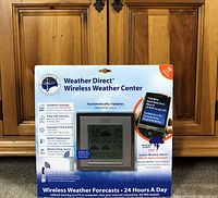 Front of sealed retail package showing Weather Direct Weather Center and LCD unit
