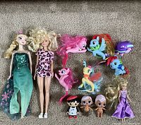 Group shot of all 11 dolls and figures