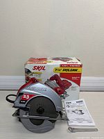 Saw, box, manual and wrench front view