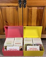 Red and yellow boxes open showing recipe cards