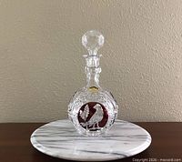 Front view of Elisabeth Hutte cranberry overlay lead crystal decanter with stopper