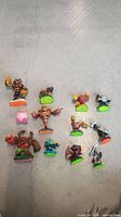 Top-down view of all ten Skylanders figures displaying different characters and base colors