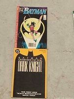 Front covers of both Batman comic books