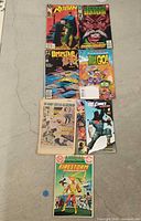 Front covers of seven DC comic books laid out in one column