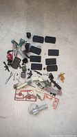 All accessories scattered on floor showing variety of stands, weapons, packs, sprues