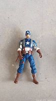 Front view of full Captain America action figure on neutral background