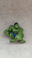 Front view of Hulk figure seated, showing torso, fists, facial details
