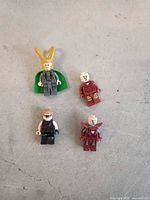Four Lego Marvel minifigures laid out