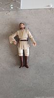 Front view of Obi-Wan Kenobi 3.75" figure lying flat showing full costume detail