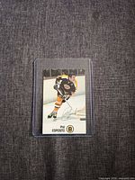 Front of Phil Esposito Esso NHL All-Star card in plastic holder